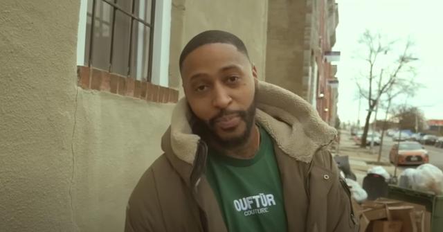 Richard Webster performing one of his songs in Baltimore.