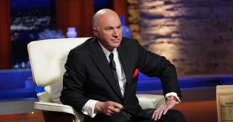 Kevin O'Leary wearing a suit and looking serious as he contemplates a deal on 'Shark Tank'.