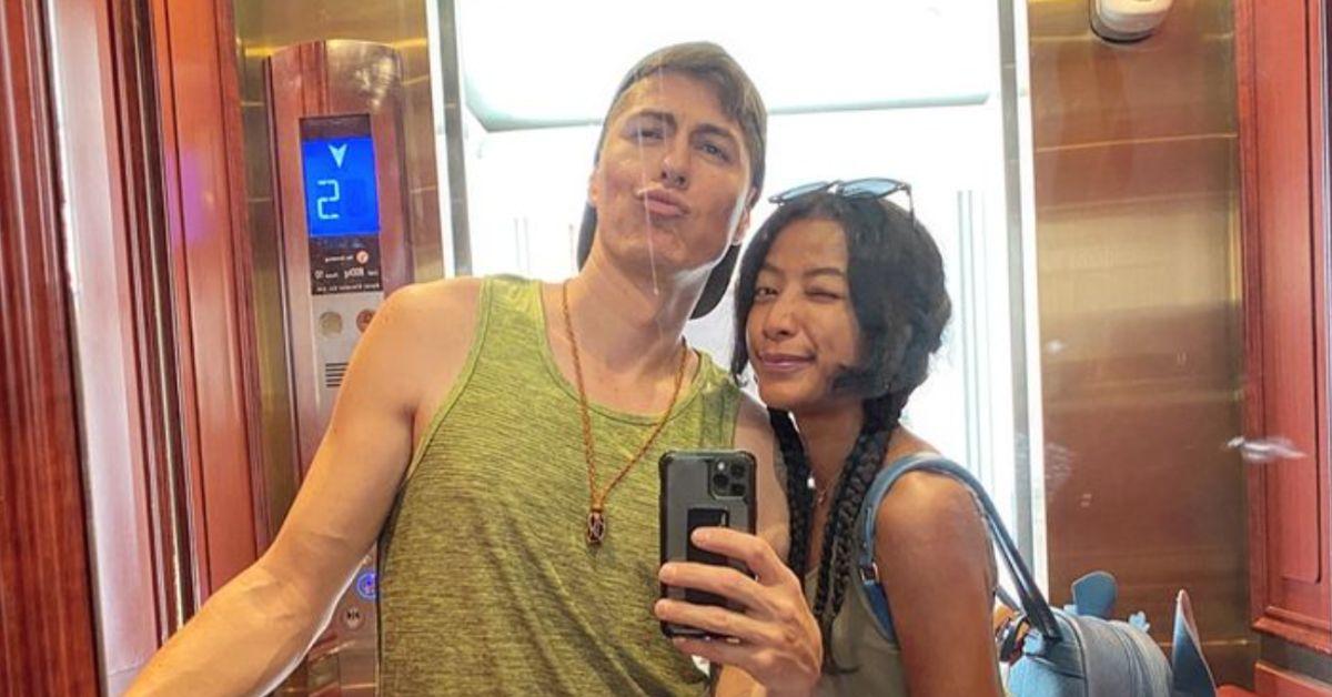 James and Tatha pose for a mirror selfie on an elevator