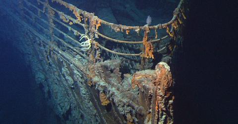 The bow of the Titanic looms in the darkness