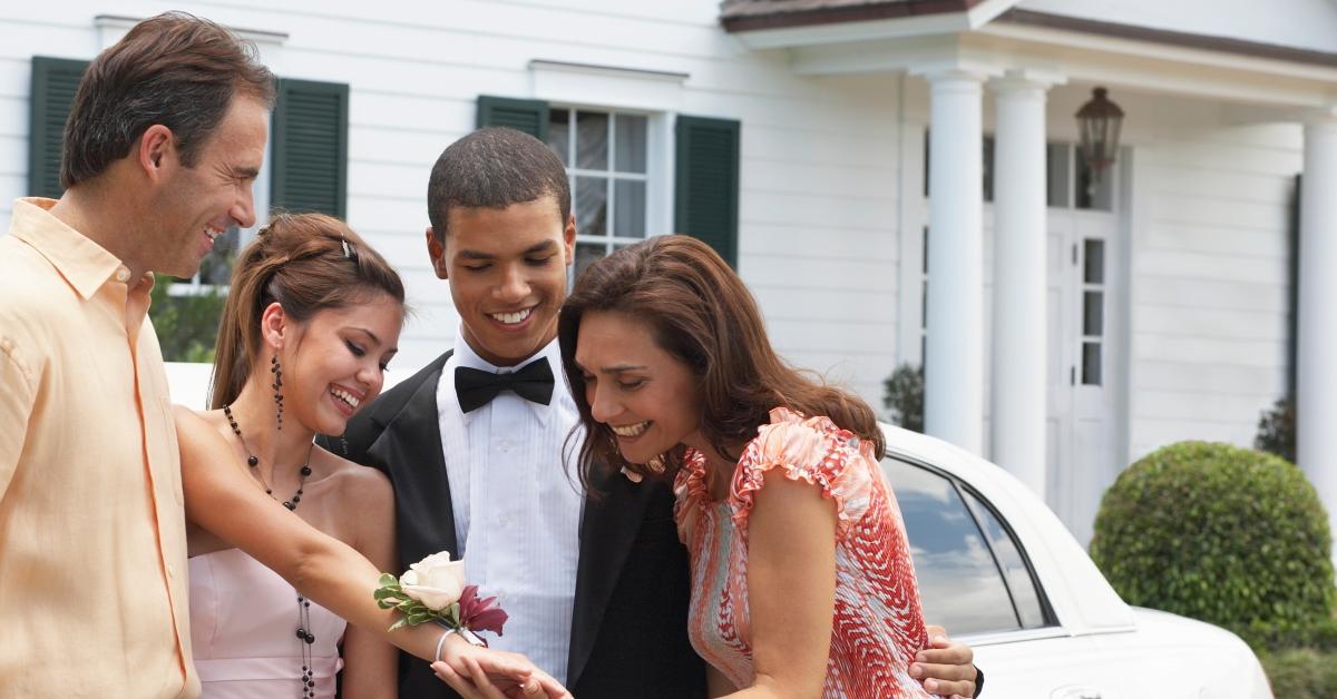 family admires corsage at prom sendoff