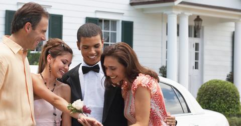 family admires corsage at prom sendoff