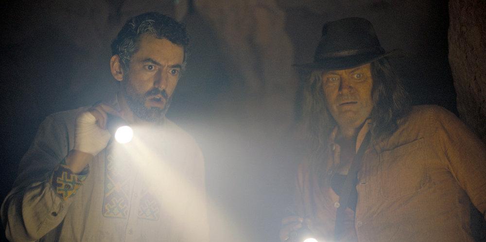 Luis Gerardo Méndez as Baltasar Frías and Nick Offerman as Murray Thompson in 'The Resort.'