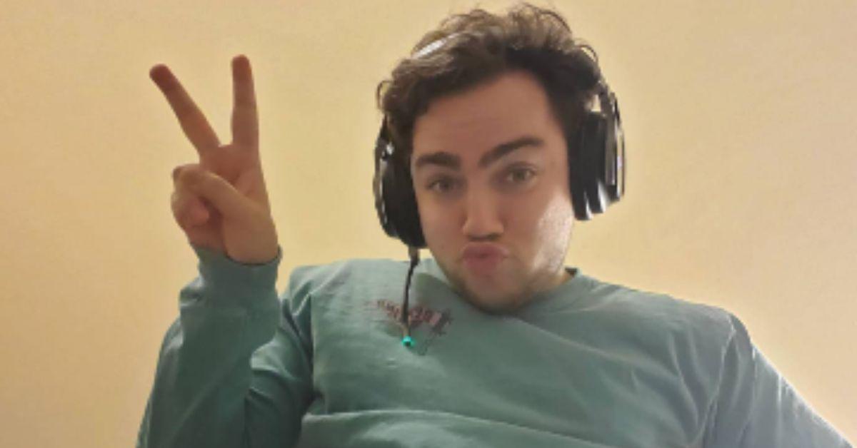 Mizkif posing while wearing a headset.