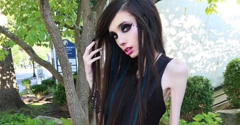 Eugenia Cooney pulling her hair away from her face.