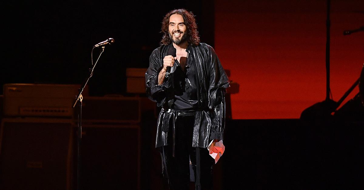 Russell Brand speaking on stage during the 2020 Musicares event. 