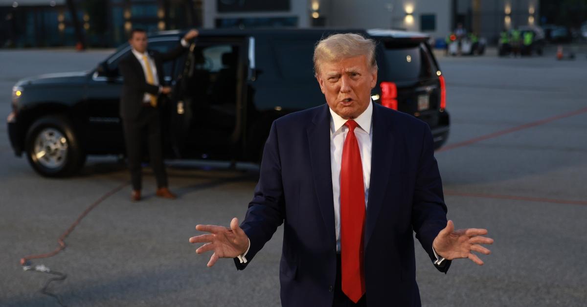 Former U.S. President Donald Trump seen speaking at Atlanta Hartsfield-Jackson International Airport after surrendering at the Fulton County jail on August 24, 2023 in Atlanta, Ga. 