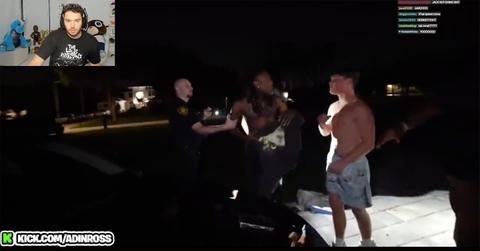 Jack Doherty and Izi Prime outside of Jack Doherty's house with police.