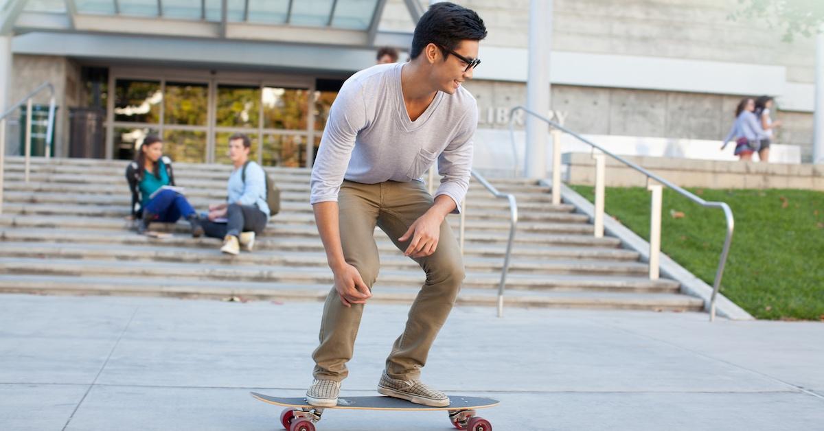 A young man riding a skateboard