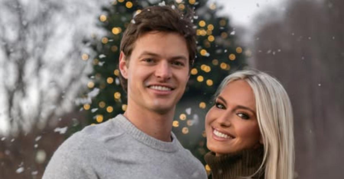 Will Kulp and Emmy Sharret from Southern Hospitality embrace in front of a Christmas tree.