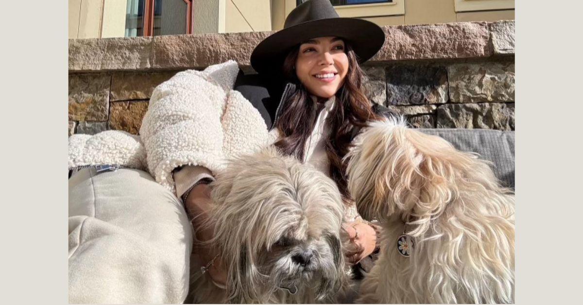 Eilyn poses with her dogs for a photo