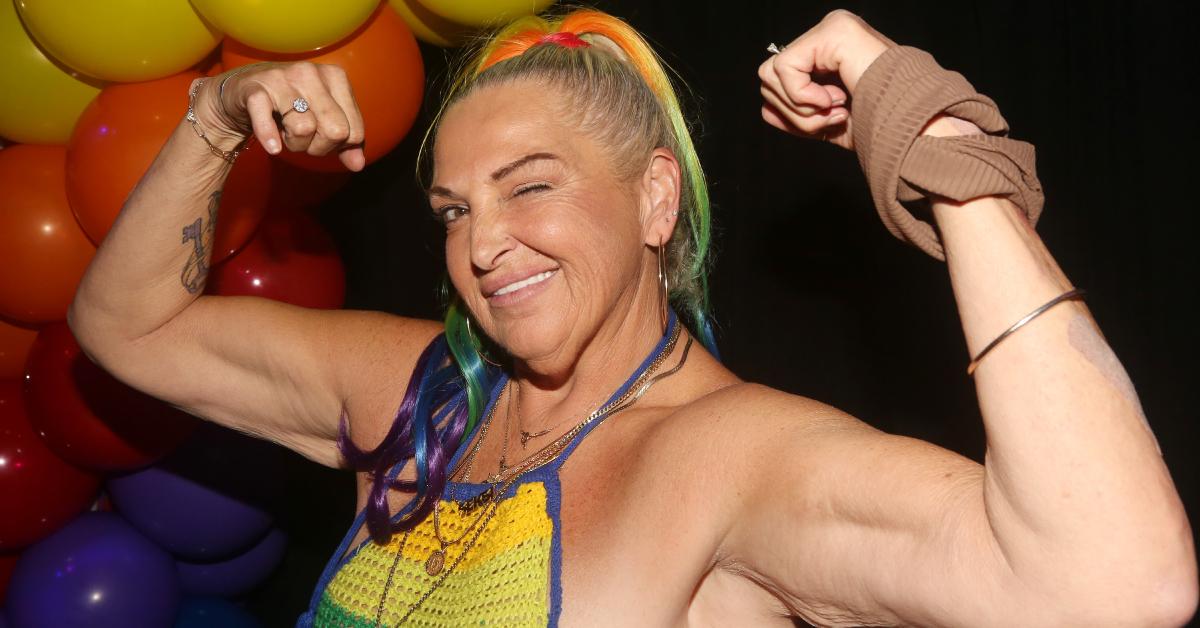 Angela Deem shows off her biceps and winks for the camera at Dolce Aesthetics 3rd Annual Pride Event at The Dickens NYC LGBTQ+ Bar on June 13, 2023.