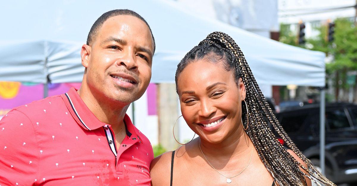 (l-r): Mike Hill and Cynthia Bailey smiling in a photo together. 