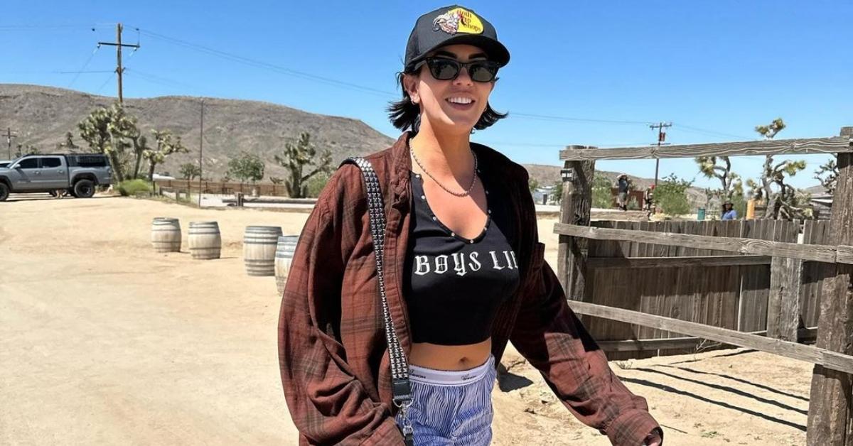 Katie Maloney in a "boys lie" shirt on a ranch