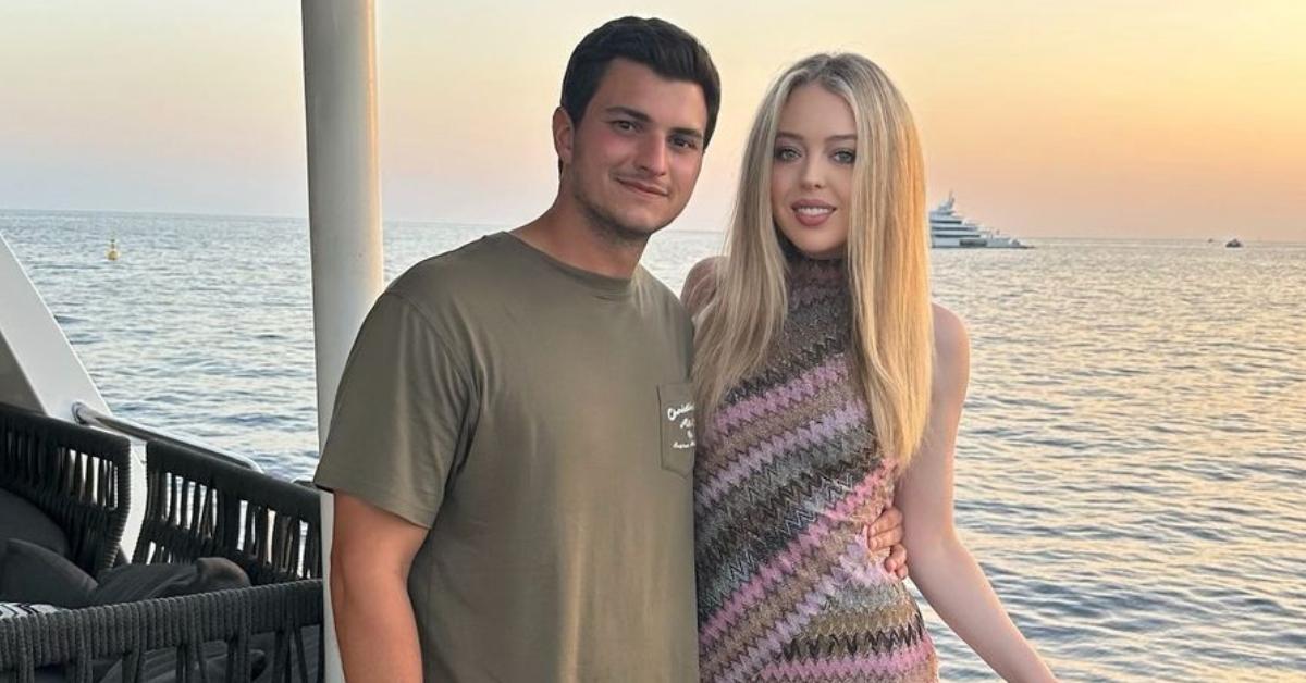 Tiffany Trump and her husband, Michael Boulos, standing by the water.