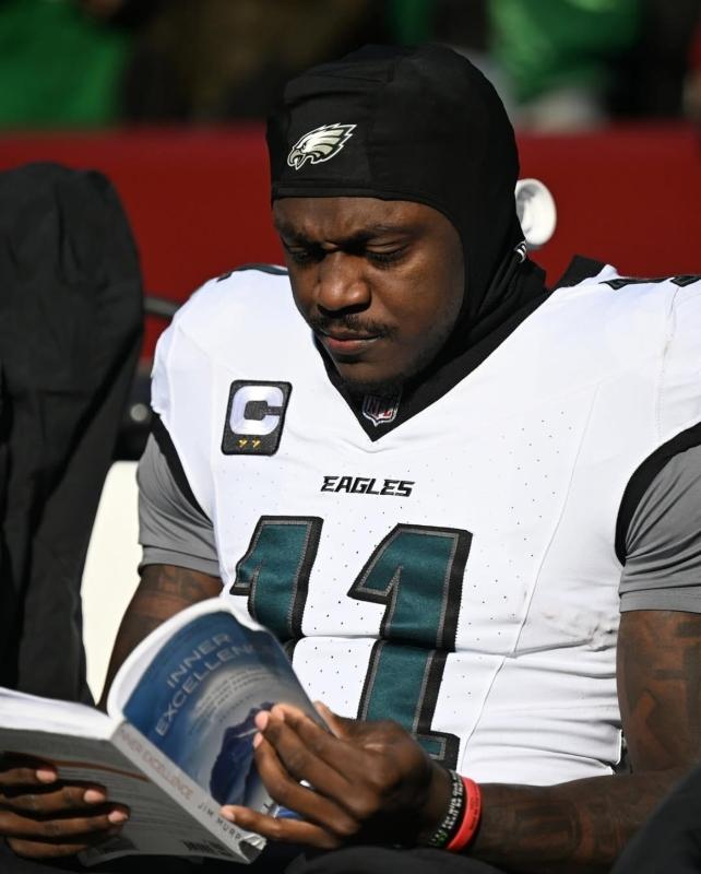 A.J. Brown reading at a football game