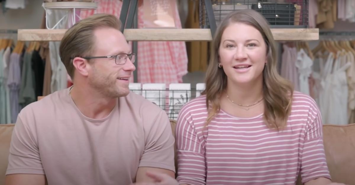 Adam and Danielle Busby talk in a confessional.