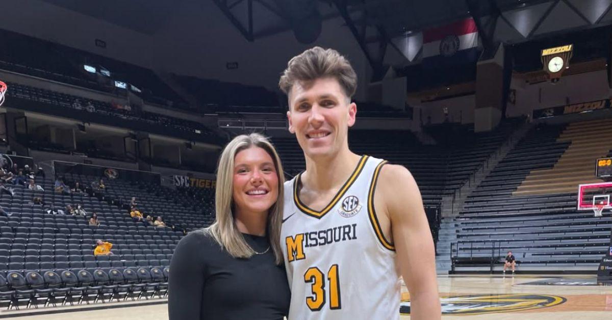 Caleb Grill and his girlfriend on a basketball court. 