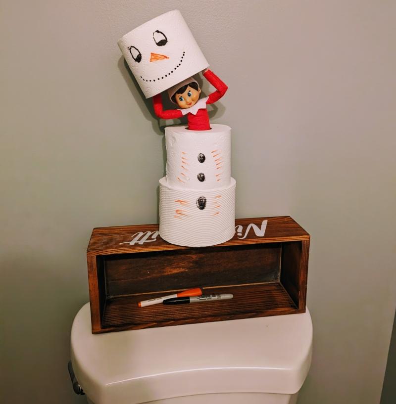 Elf on the Shelf in the bathroom