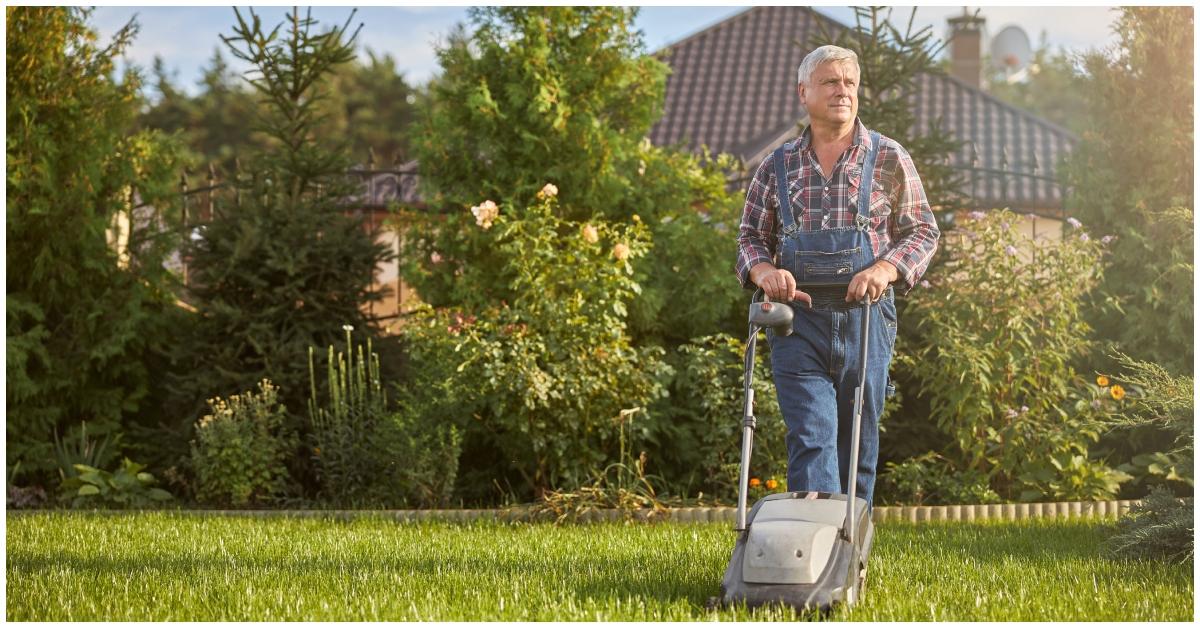 A man mowing a lawn