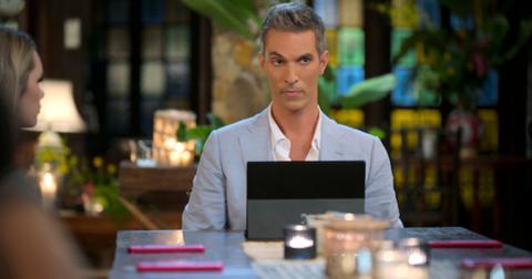 Ari Shapiro sits at a table with The Mole contestants
