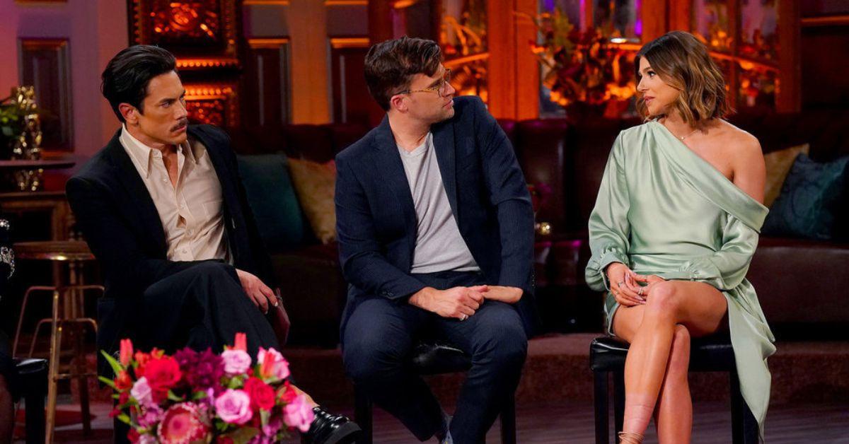 (l-r): Tom Sandoval and Tom Schwartz looking at Raquel Leviss speaking at the 'Vanderpump Rules' Season 10 reunion.