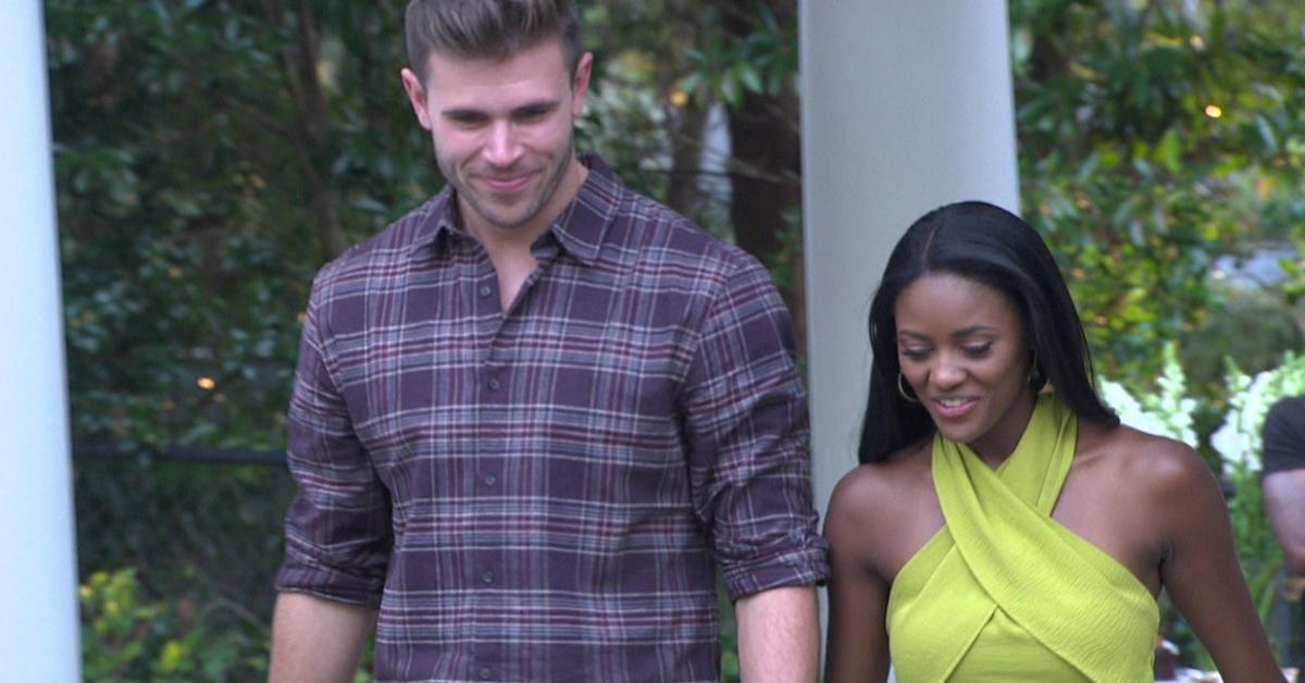 Charity and Zach walking together during her hometown on The Bachelor Season 27