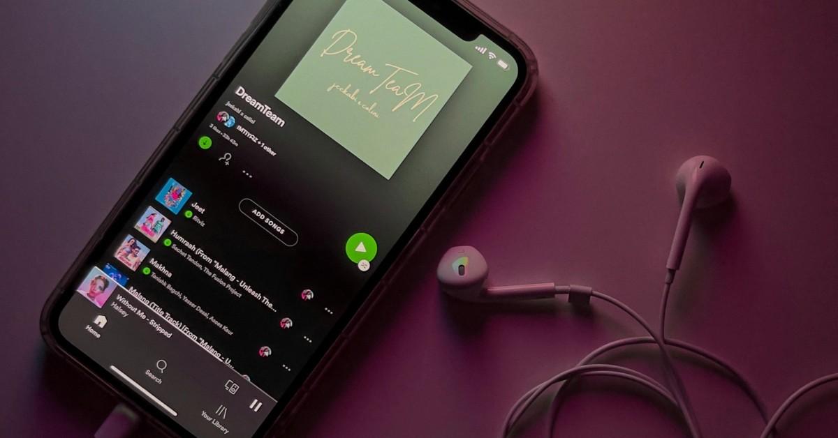 Someone listening to music on their smartphone