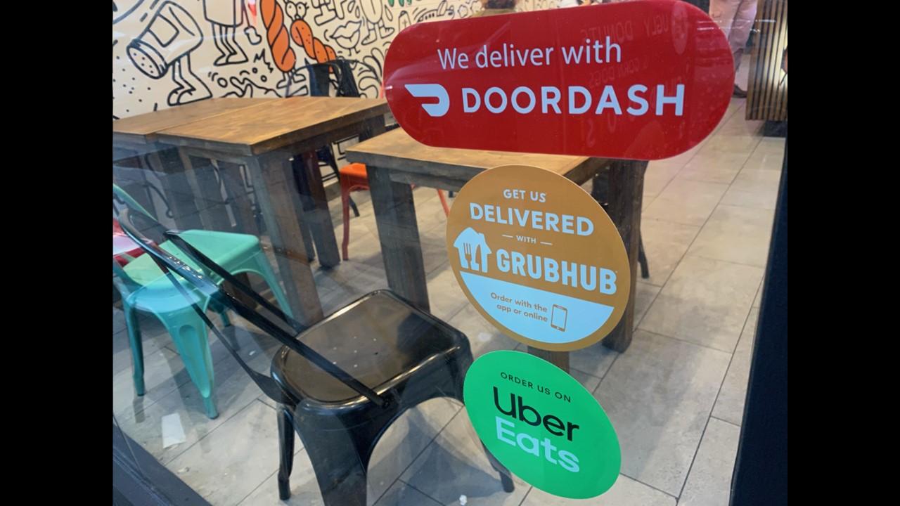 Stickers for food deliver app services in a restaurant window