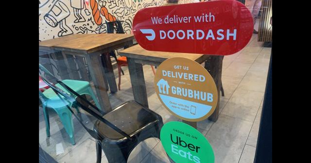 Stickers for food deliver app services in a restaurant window