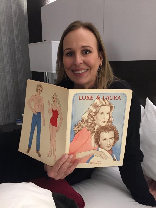 Genie Francis with a Luke and Laura paper doll book.