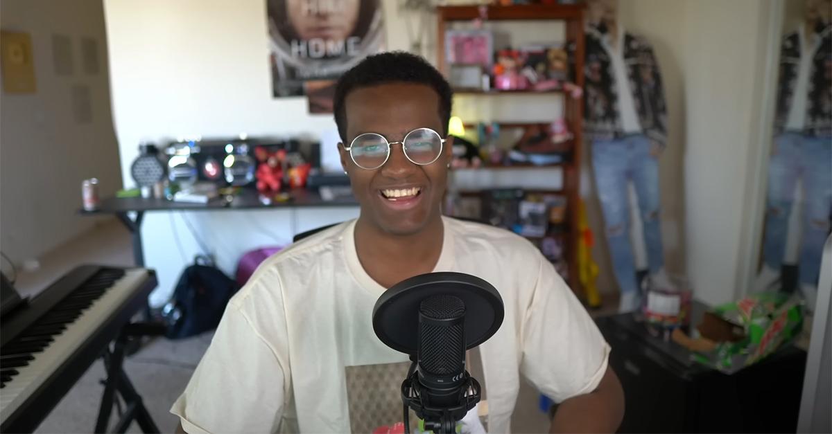 Twomad sitting in front of a microphone in 2023