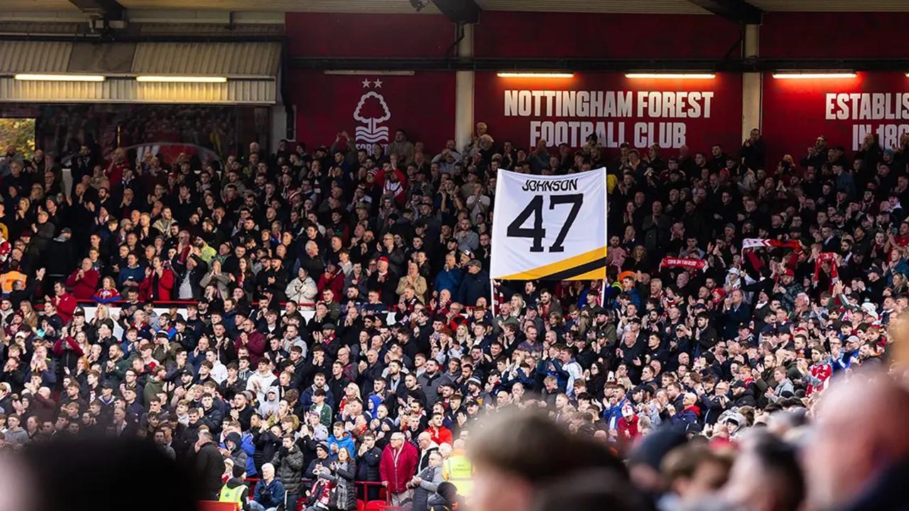 Adam Johnson's jersey number being held aloft in the crowd in Nottingham. 