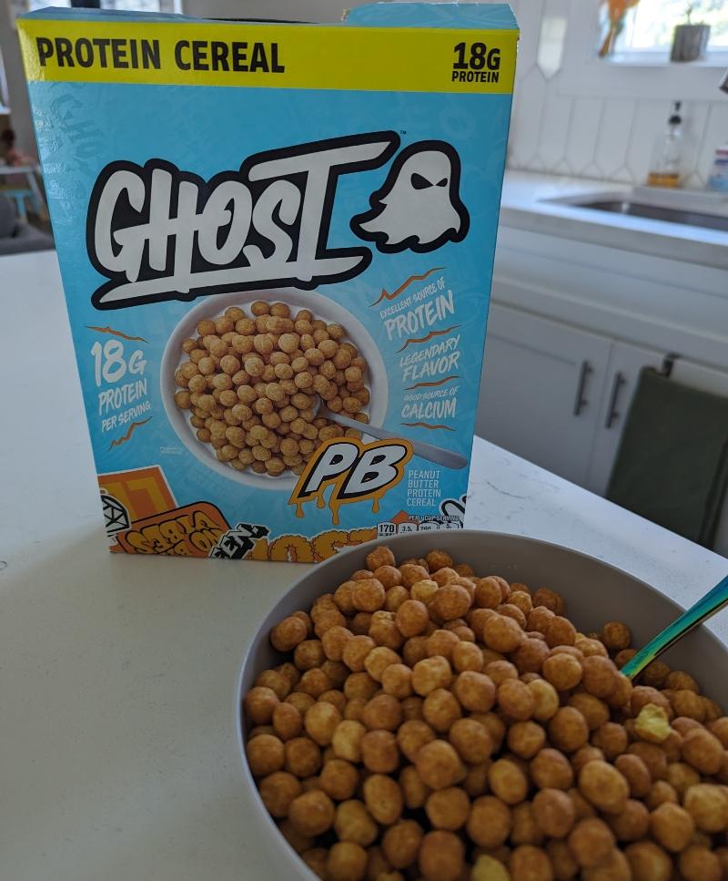 A box of Ghost PB Cereal with a bowl of cereal