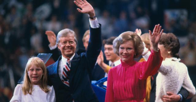US President Jimmy Carter, First Lady Rosalynn Carter, and their daughter, Amy, wave to supporters from the stage at the 1980 Democratic National Convention.