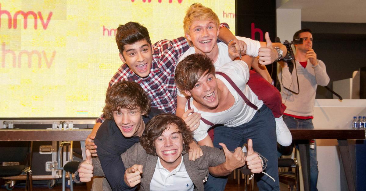 One Direction smiles and poses together in February 2012.