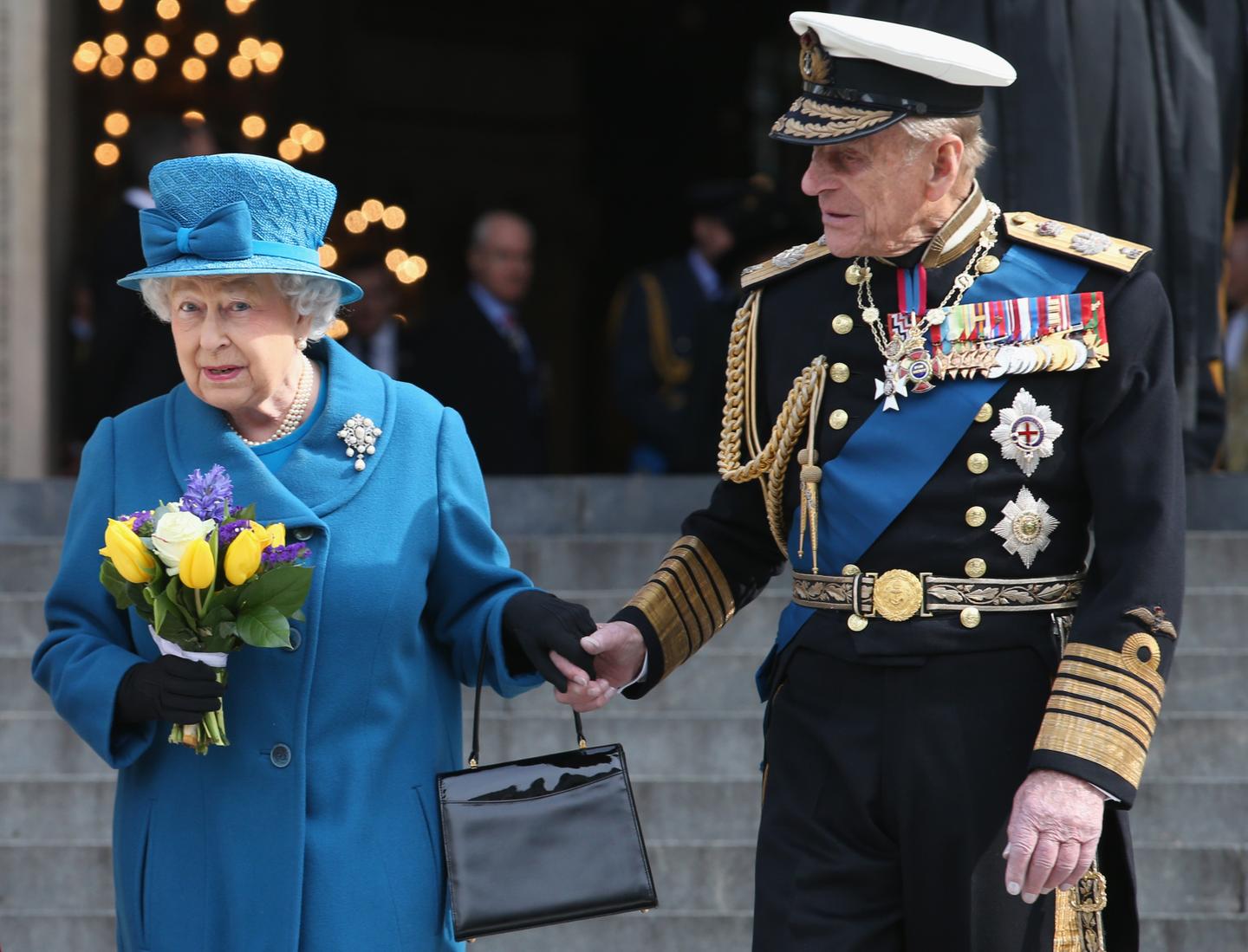 Why Does the Queen Always Carry a Purse? It Serves Multiple Purposes