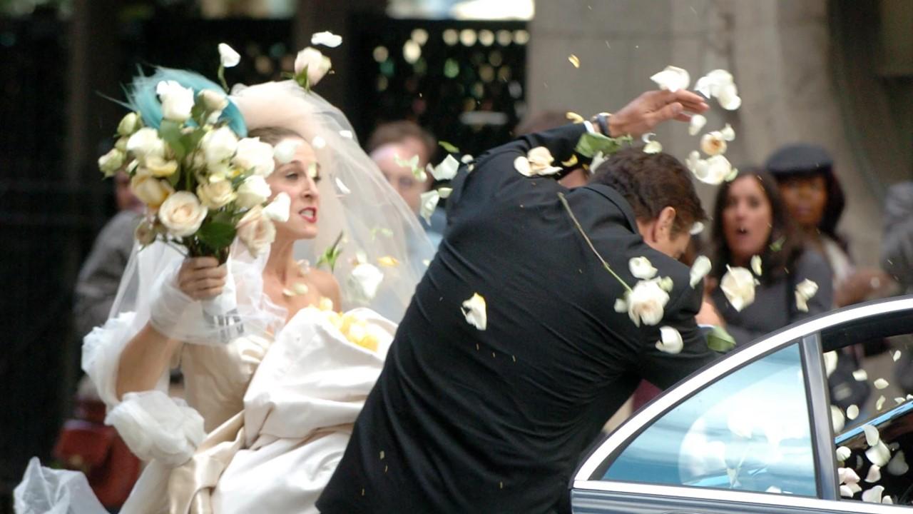 Carrie hitting Big with her bouquet on their wedding day