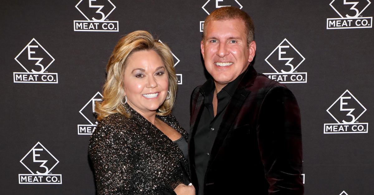 Todd and Julie Chrisley pose at a Meat Co. event.