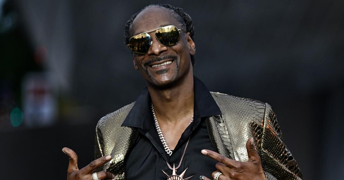 Snoop Dogg poses on the red carpet as he arrives for 'The Prelude to the Olympics' at The Fondation Louis Vuitton in Paris on July 25, 2024, ahead of the 2024 Paris Olympics. 