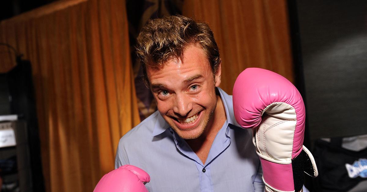 Billy Miller wearing boxing gloves at the Daytime Emmys. 