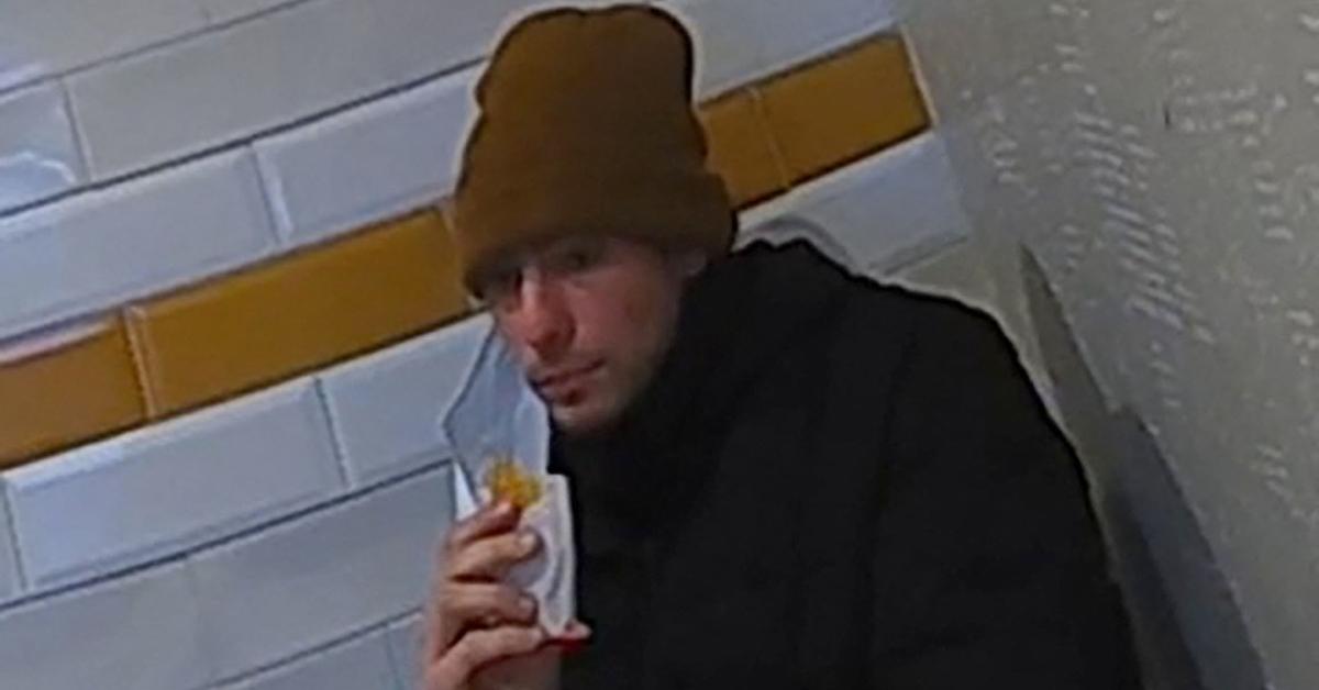 Luigi Mangione eating a hash brown in the Altoona McDonald's