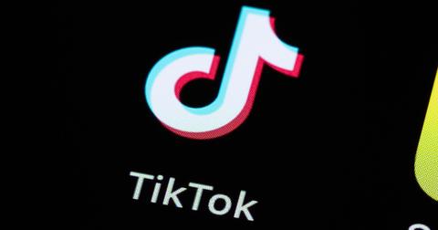 A TikTok logo on a phone screen.