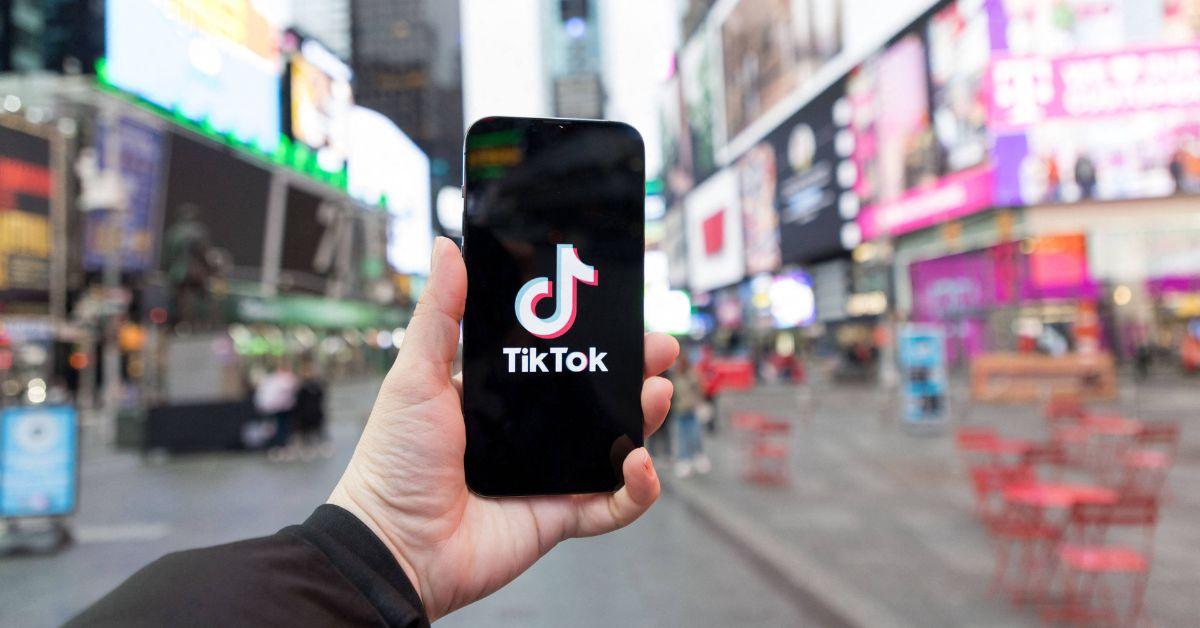 The TikTok logo on a phone in Times Square.