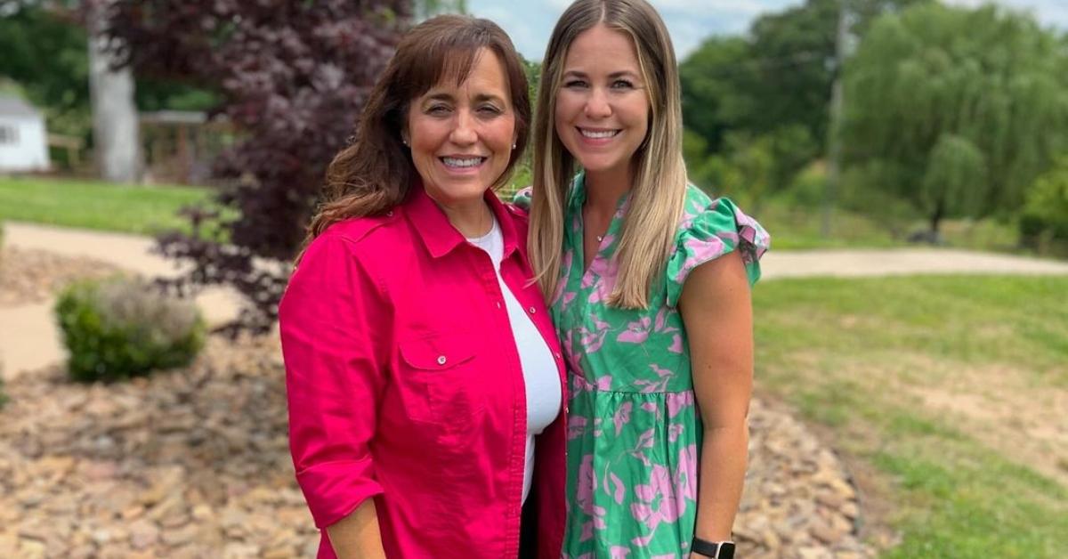 Michelle and Jana Duggar outside of the Duggar house