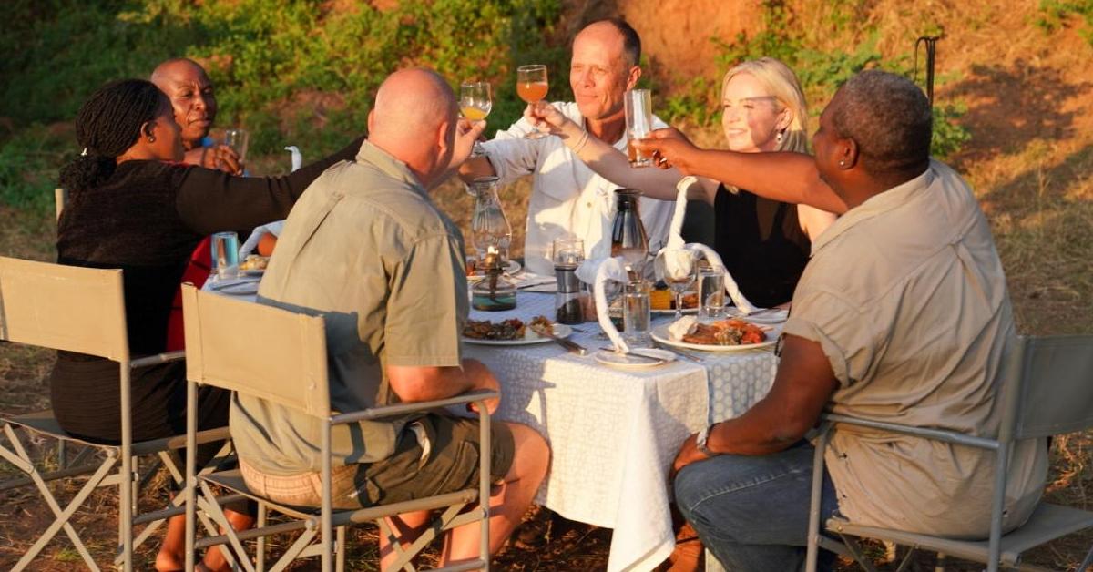 Grant and Lynsey Cumings make a toast with resort staff