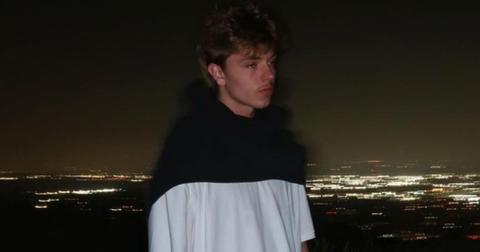Jayden Federline poses in front of a blurry city skyline