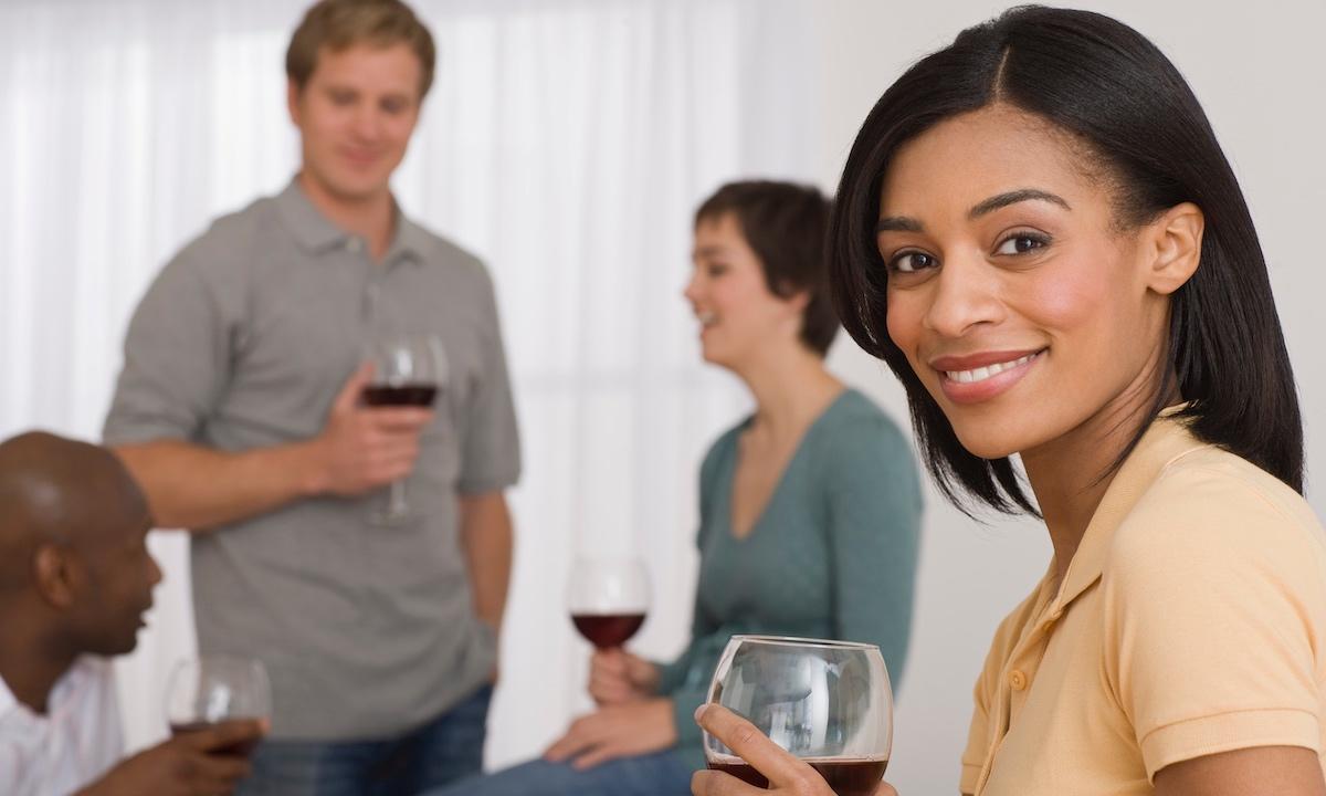 A group of people drinking wine