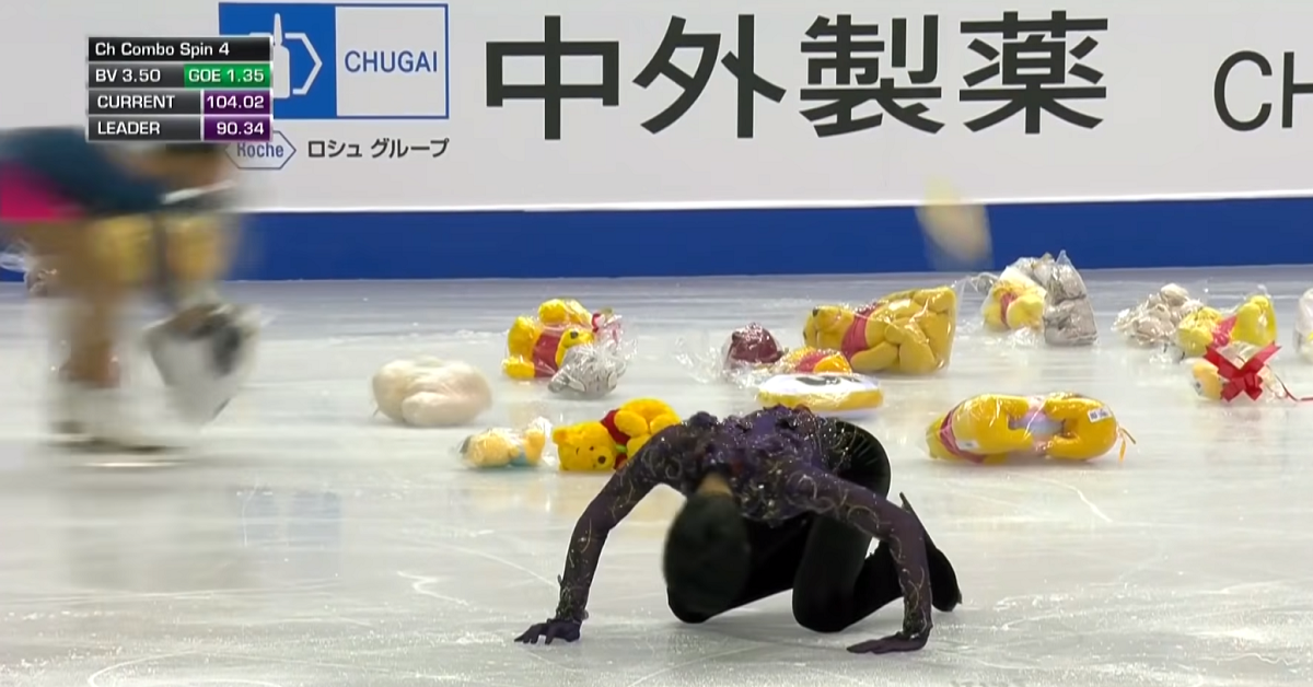 Stuffed animals on an ice rink.