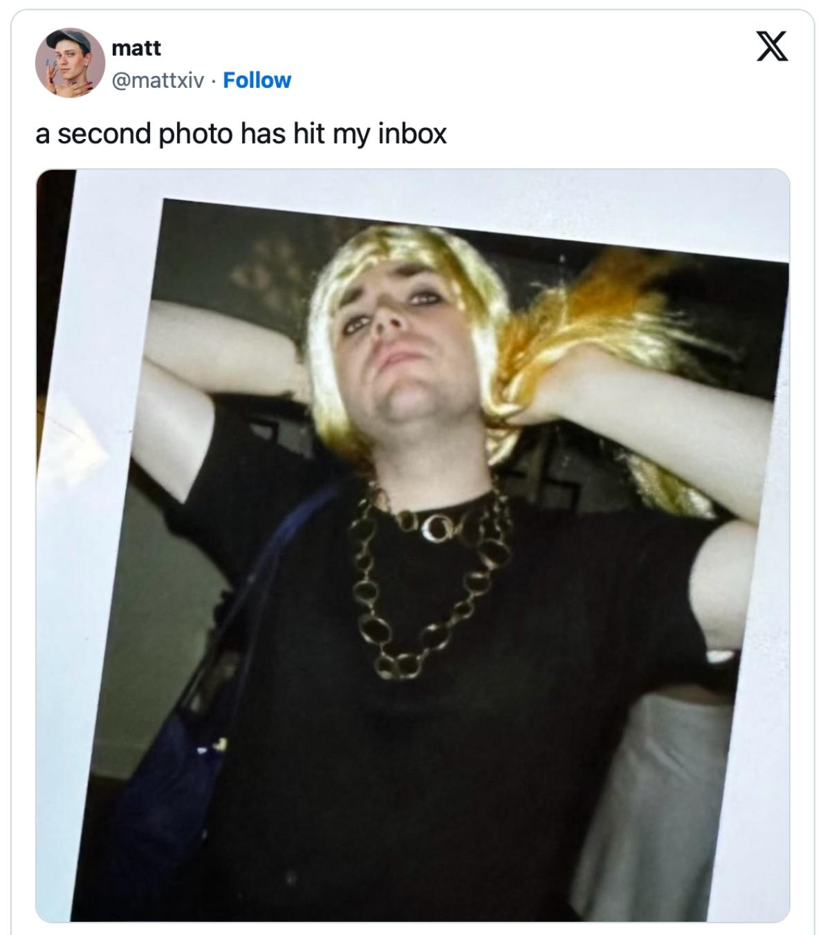 JD Vance drag photo with blond wig and skirt